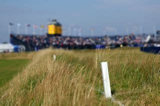 What do red, yellow and white stakes mean on a golf .